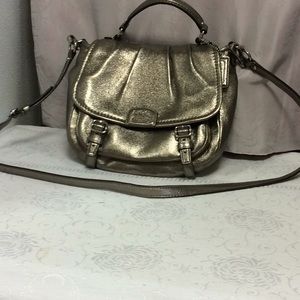 Gold tone Coach bag.